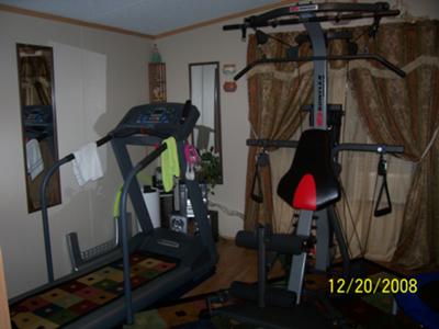 The treadmill next to my Bowflex