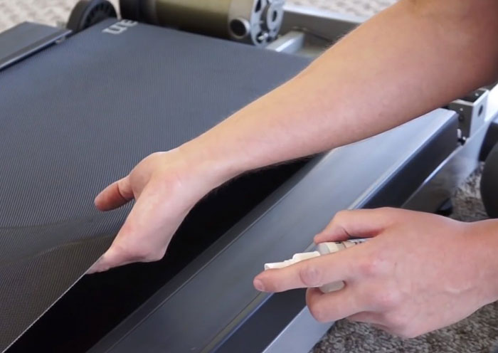 applying lubricant into the treadmill